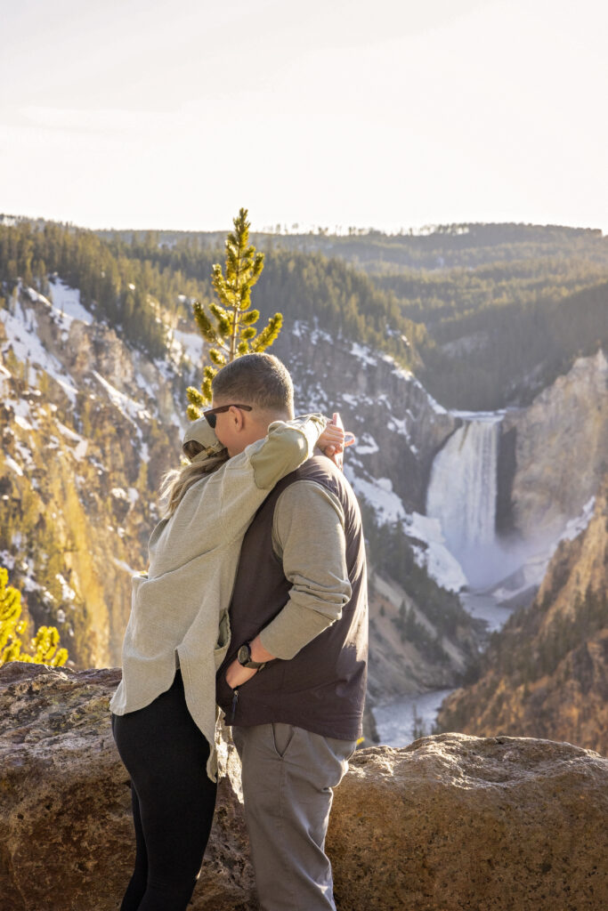 Romantic moment between couple during golden hour at Grand Canyon of the Yellowstone.