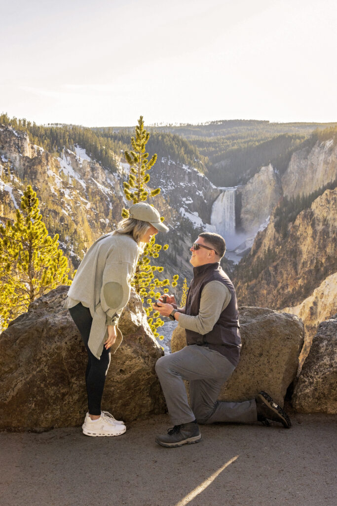 Golden sunset light on the couple with epic waterfall scenery at Artist Point.