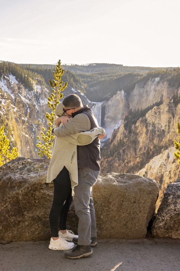 Natural light engagement photo at Yellowstone’s Artist Point during sunset.