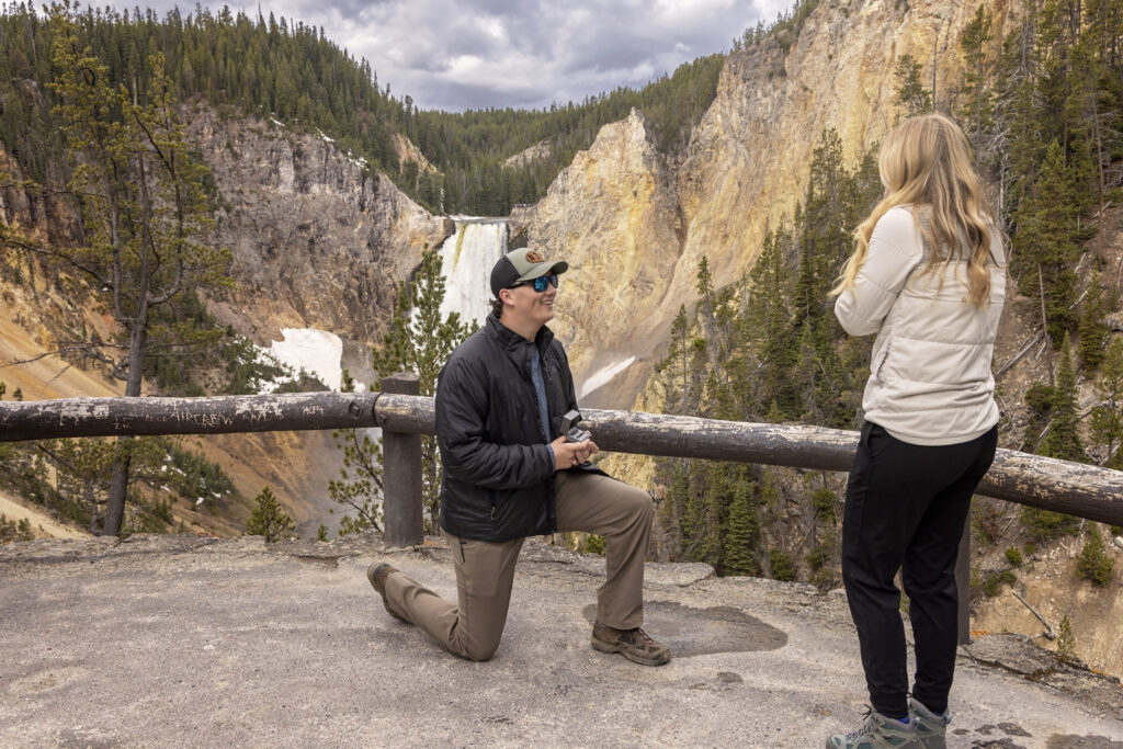 Man proposing to his girlfriend at scenic overlook in Yellowstone