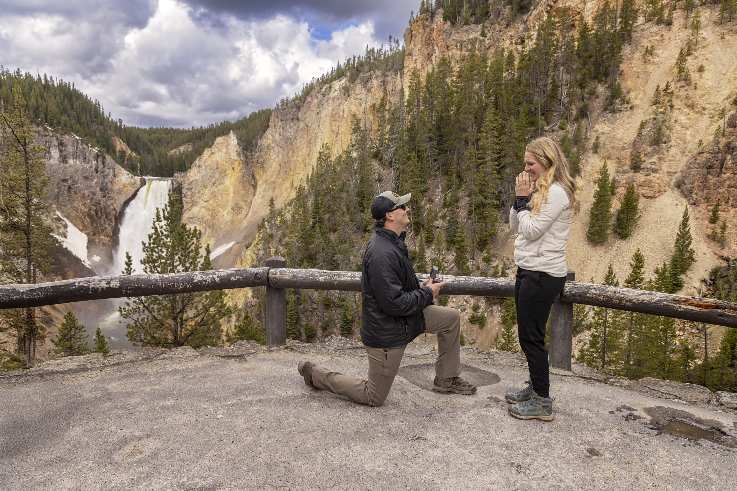 Man proposing to his girlfriend at scenic overlook in Yellowstone