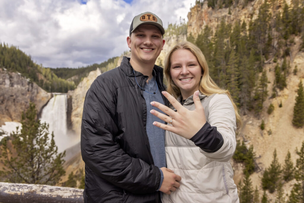 Newly engaged with the best backdrop ever.