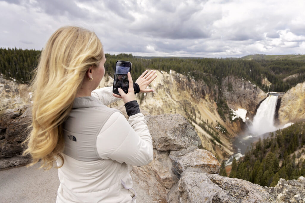 Close-up of engagement ring with canyon in background