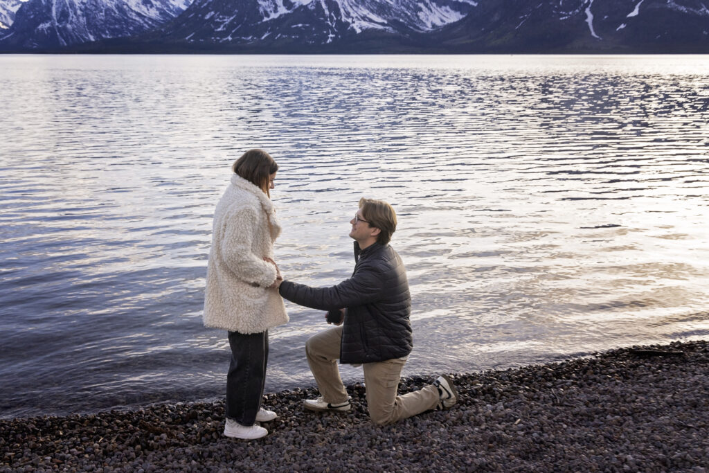 The moment it all begins—Avery gets down on one knee.