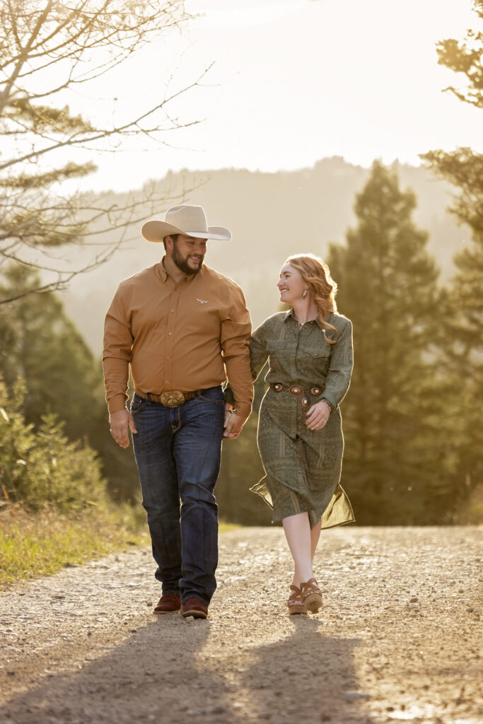 Couple dancing in Montana mountains at golden hour