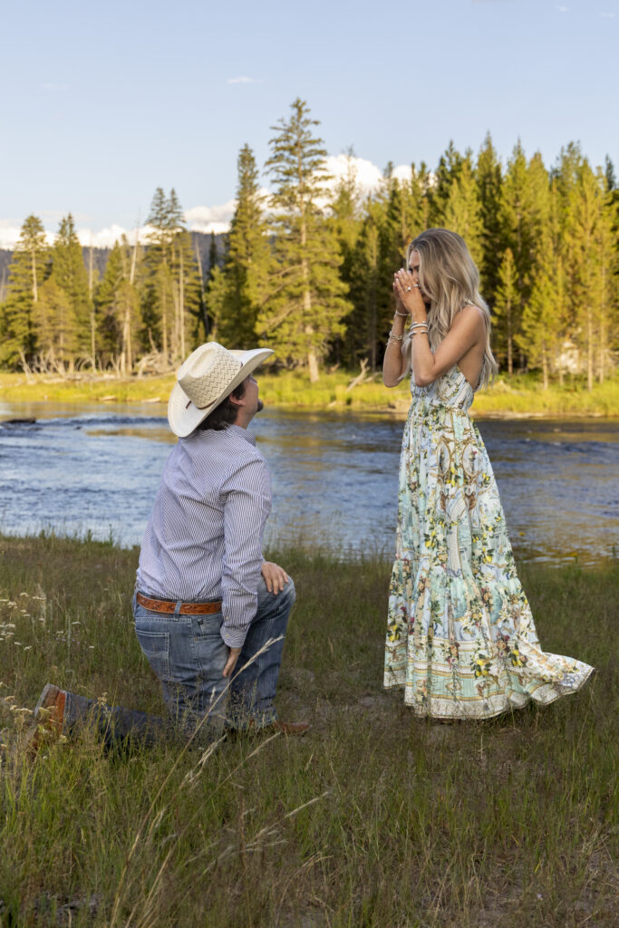 Man getting down on one knee in Yellowstone