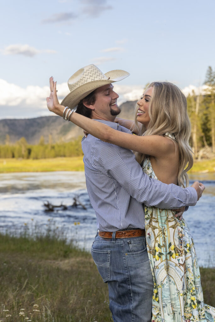 Couple celebrating engagement in Yellowstone